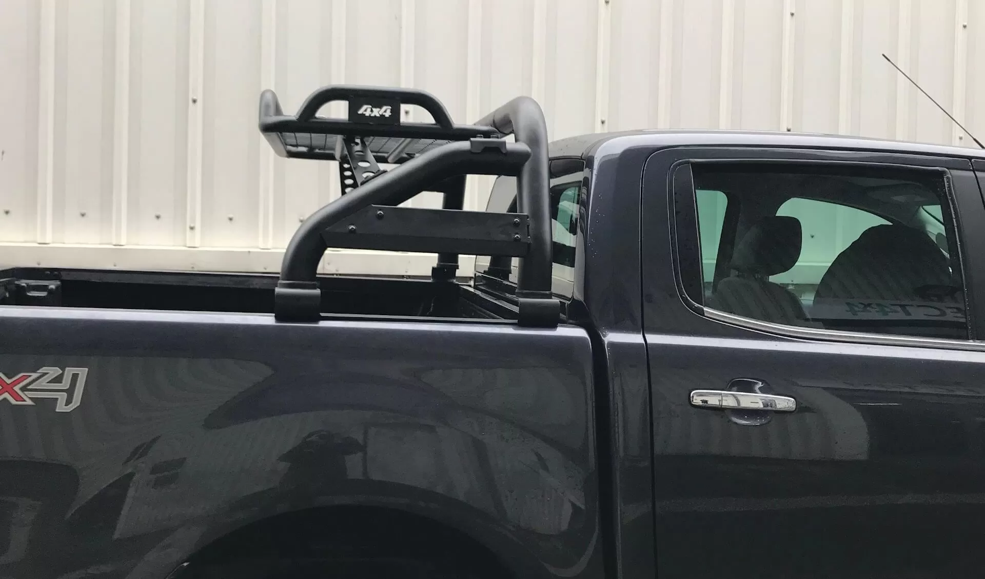 Black Short Arm Roll Sports Bar with Cargo Basket Rack for the Ford Ranger