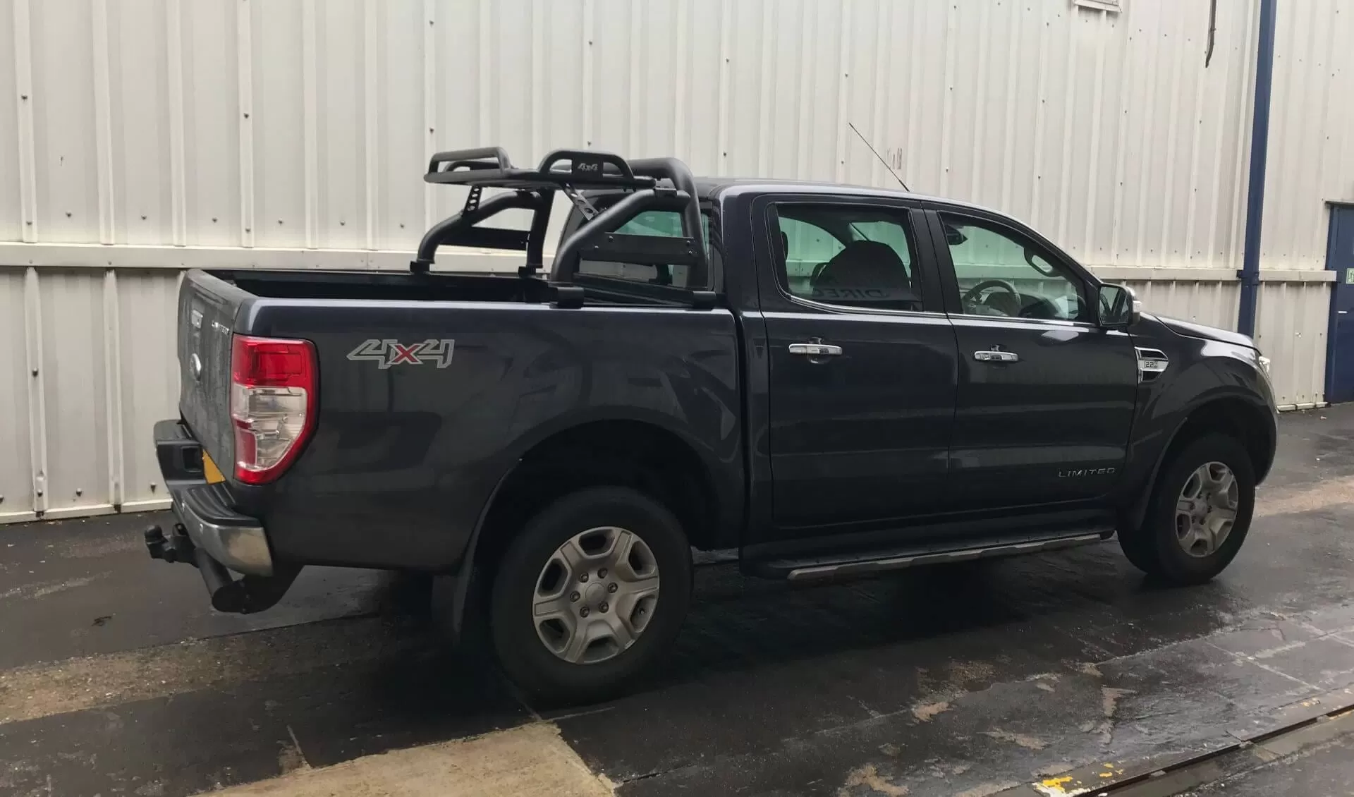 Black Short Arm Roll Sports Bar with Cargo Basket Rack for the Ford Ranger